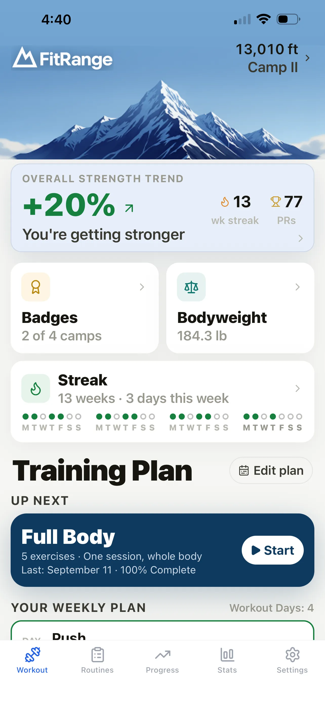 FitRange home screen at 13,010 ft, Camp II, showing the overall strength trend, a weekly streak, badges, bodyweight, and the next workout in the training plan.